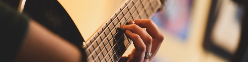 Close up of hands playing classic guitar. Selective focus.